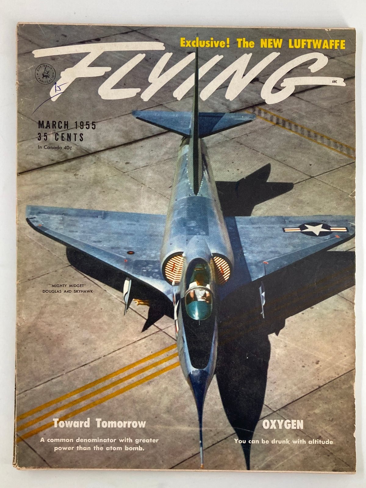 Cover of VTG Flying Magazine from March 1955 featuring the Mighty Midget Douglas A4D Skyhawk with bold title and price information.