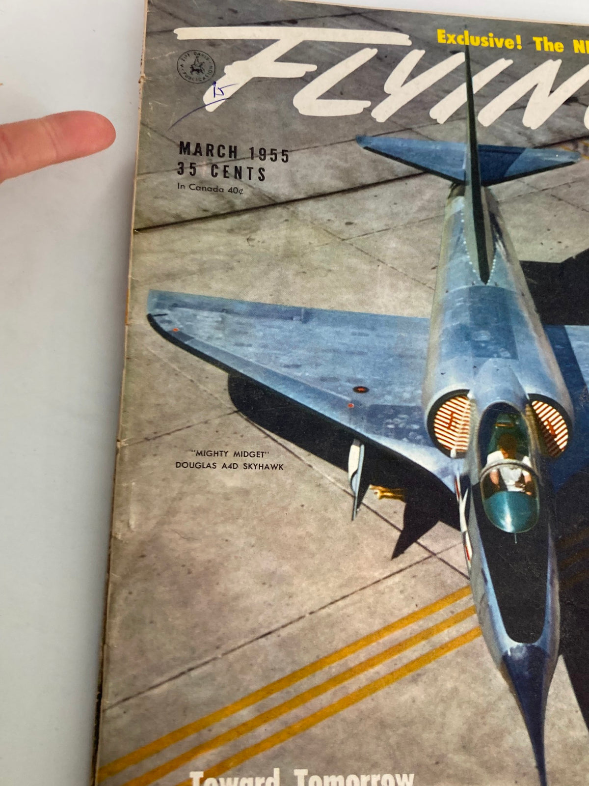 Close-up view of the cover of VTG Flying Magazine March 1955 highlighting the Mighty Midget Douglas A4D Skyhawk and magazine details.