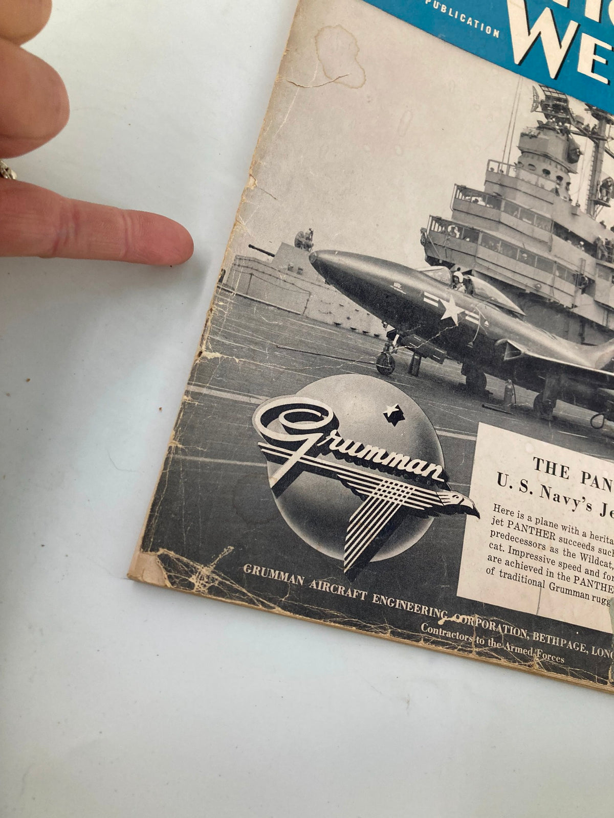 Detailed view of VTG Aviation Week Magazine August 14 1950 cover displaying Grumman logo and The Panther, U.S. Navy's Jet Fighter, with damages.