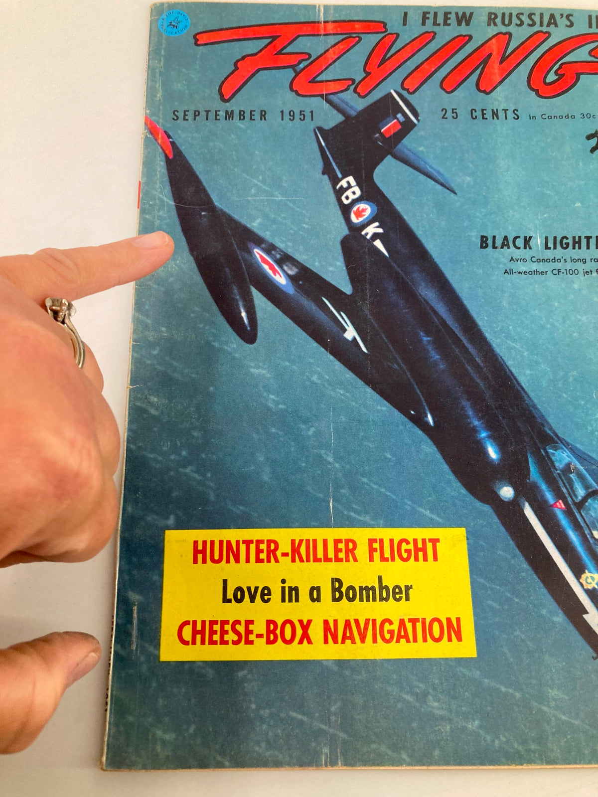 Close-up view of the VTG Flying Magazine from September 1951, highlighting details of the Black Lightning CF-100 Jet Fighter and promotional headlines.
