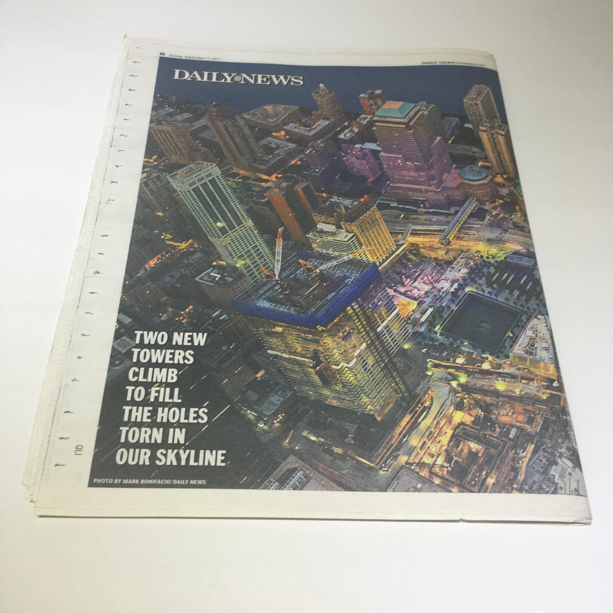 Cover image of the New York Daily News with the title 'Rise Up 911 Ten Years Later', featuring a panorama of new towers symbolizing resilience and renewal in the skyline.