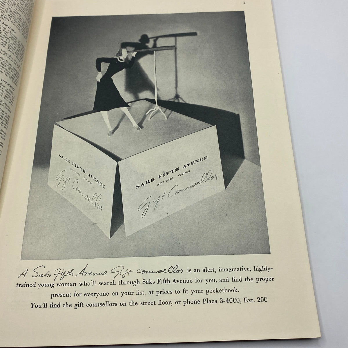 An advertisement featuring a stylish young woman posing with Saks Fifth Avenue promotional materials, showcasing holiday gift counseling services. Part of The New Yorker Complete Magazine December 11, 1937.