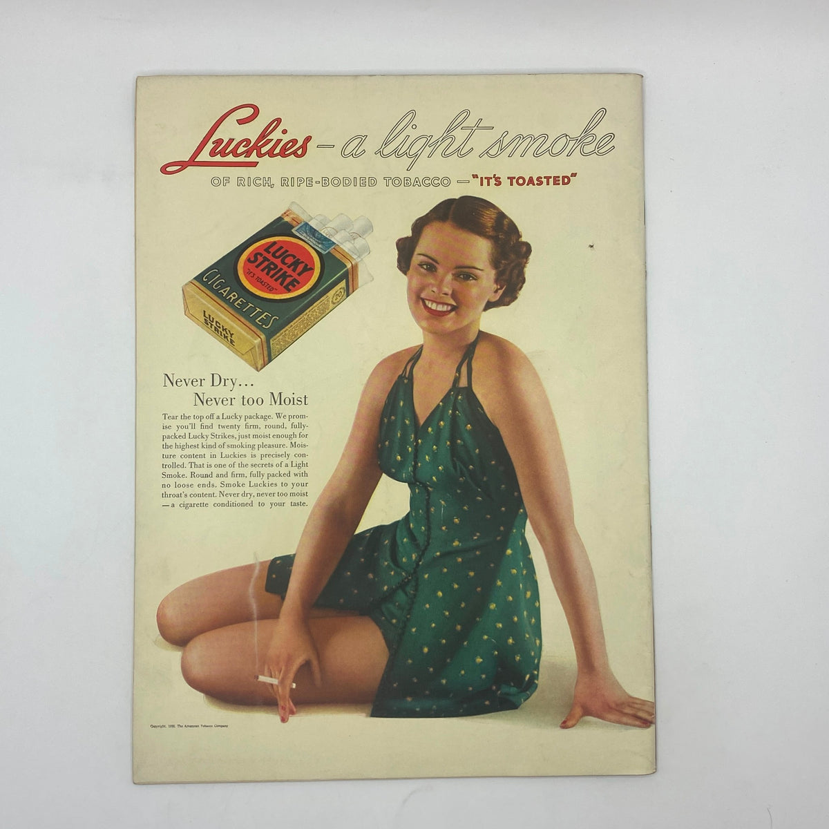 Vintage Lucky Strike advertisement featuring a smiling woman in a green polka dot dress, promoting 'Luckies - a light smoke', from the 1930s, related to The New Yorker Complete Magazine August 29, 1936 William Steig Cover.