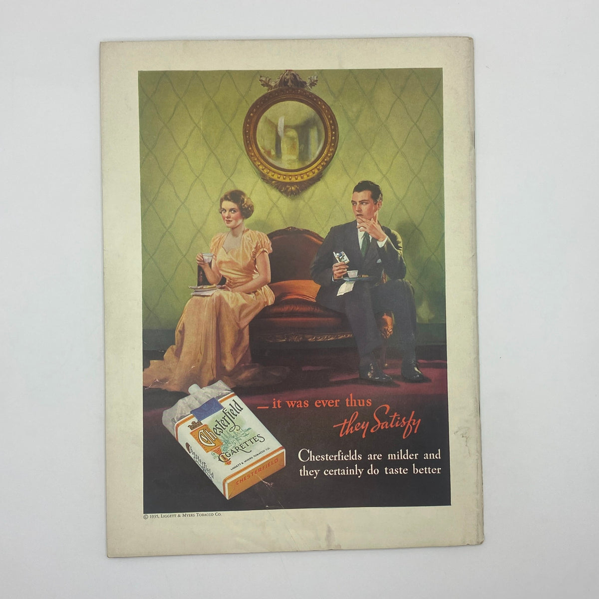 Vintage advertisement for Chesterfield cigarettes, depicting a man and woman relaxing in a stylish interior; emphasizes the quality of Chesterfield cigarettes. From The New Yorker Complete Magazine May 4, 1935 Ilonka Karasz Cover.