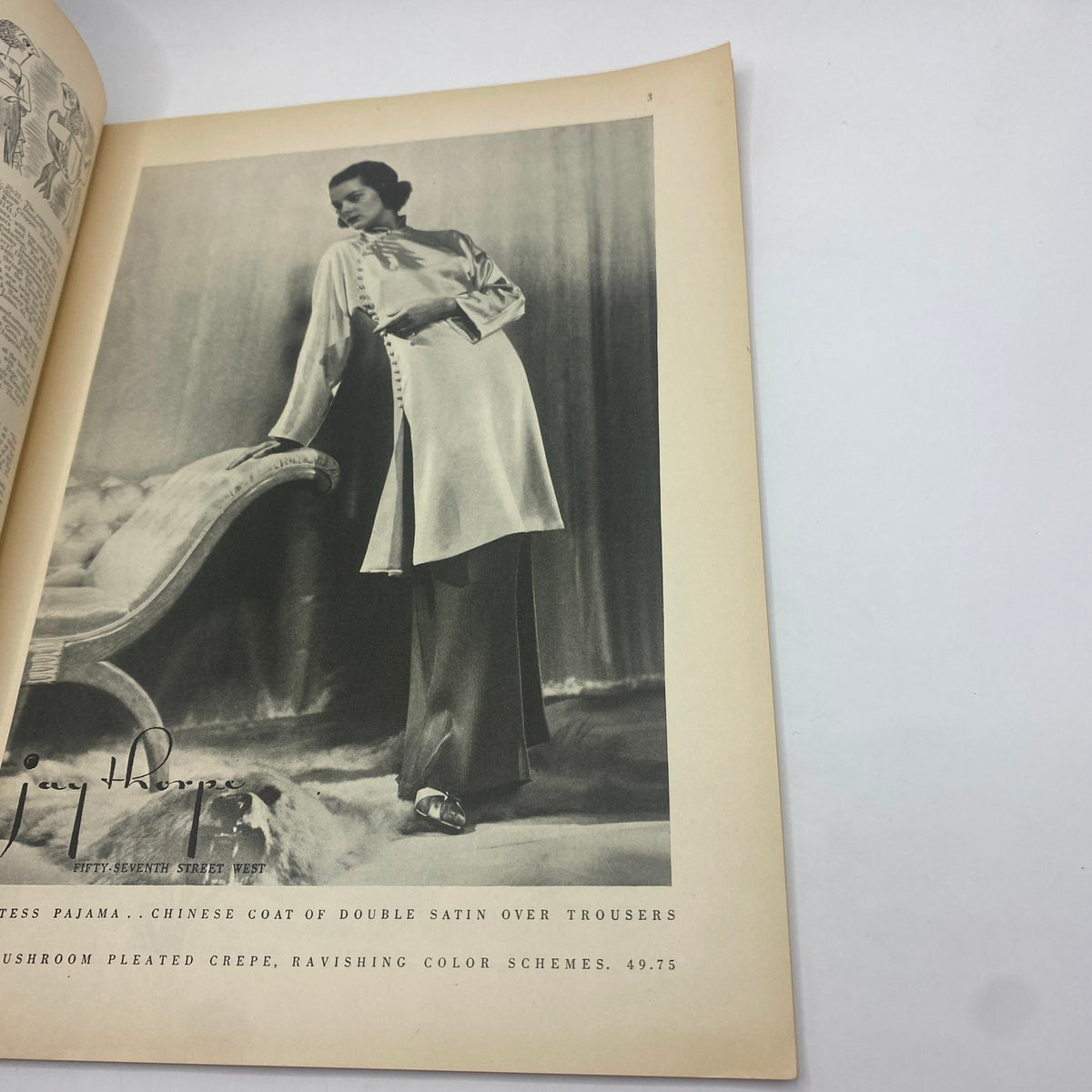 Fashion advertisement from The New Yorker Complete Magazine April 18, 1936 featuring a model in a stylish Chinese coat over trousers, showcasing 1930s fashion trends.