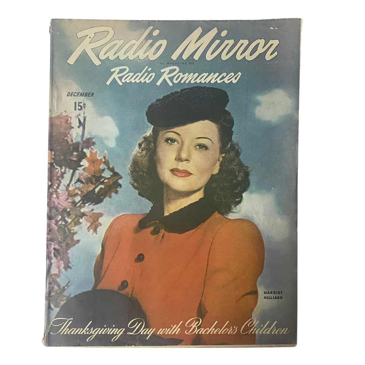 Radio Mirror Magazine December 1945 featuring Harriet Hilliard on the cover, showcasing a vintage portrait of a woman in a hat with floral background, reflecting mid-20th century fashion.