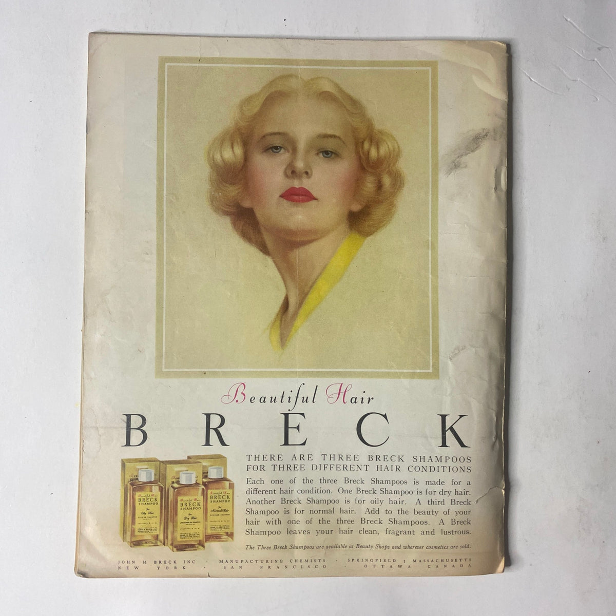Advertisement for Breck shampoo on the back cover of the January 1952 Radio and TV Mirror Magazine, promoting products for beautiful hair.