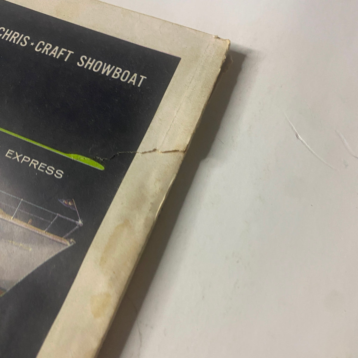 Close-up view of the edge of the March 1956 issue of Field & Stream Magazine featuring the article 'How to Catch a Trout on a Hair'. The image highlights the magazine's vintage condition with visible wear and tear.