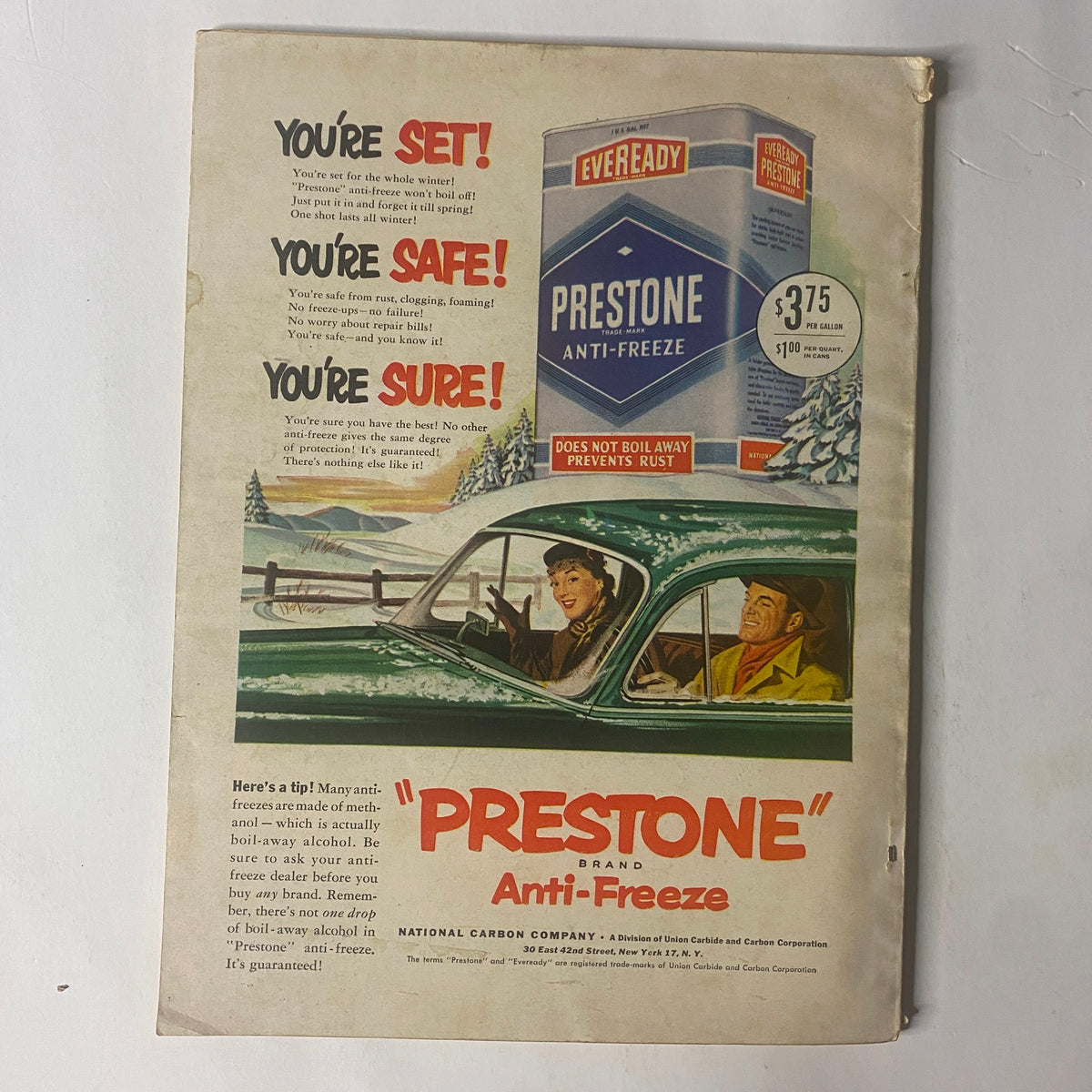 Back cover of Field & Stream Magazine, October 1951, advertising Prestone Anti-Freeze with images of a car and cheerful passengers.