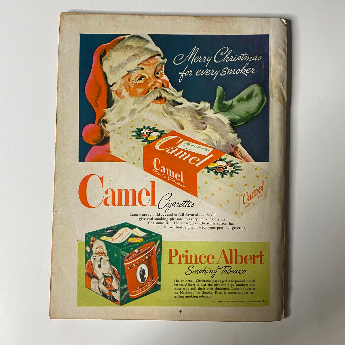 Cover of True: The Man's Magazine December 1948 Christmas Gift Issue featuring a festive Santa Claus, advertising Camel Cigarettes and Prince Albert Smoking Tobacco, showcasing vintage holiday-themed design.