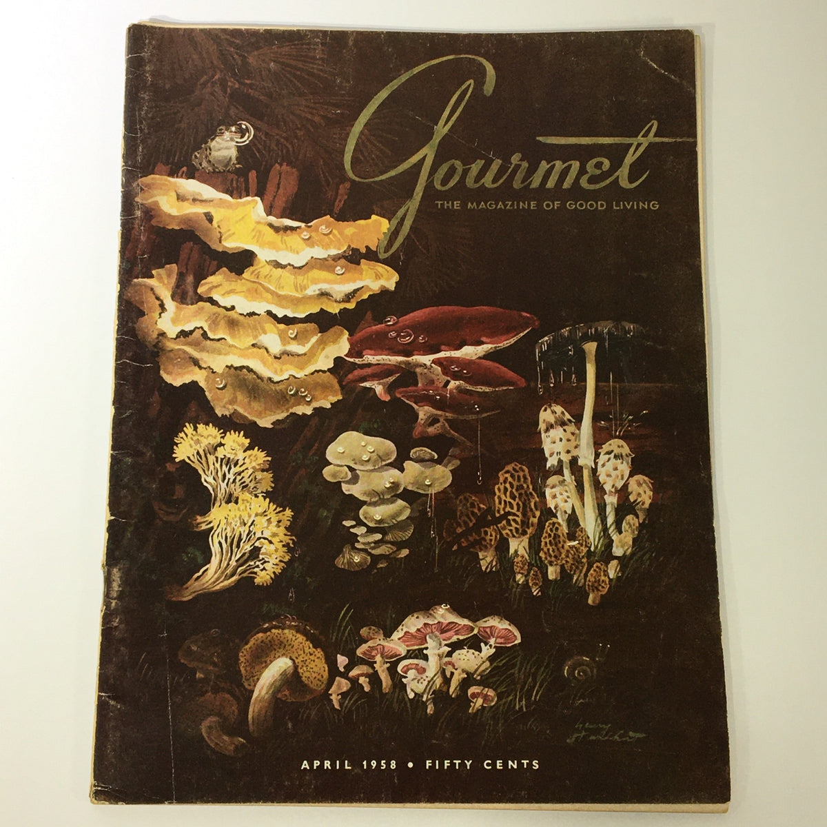 VTG Gourmet: The Magazine of Good Living - April 1958 cover featuring vibrant illustrations of mushrooms and aquatic life, showcasing the theme "The Fly is Cast".