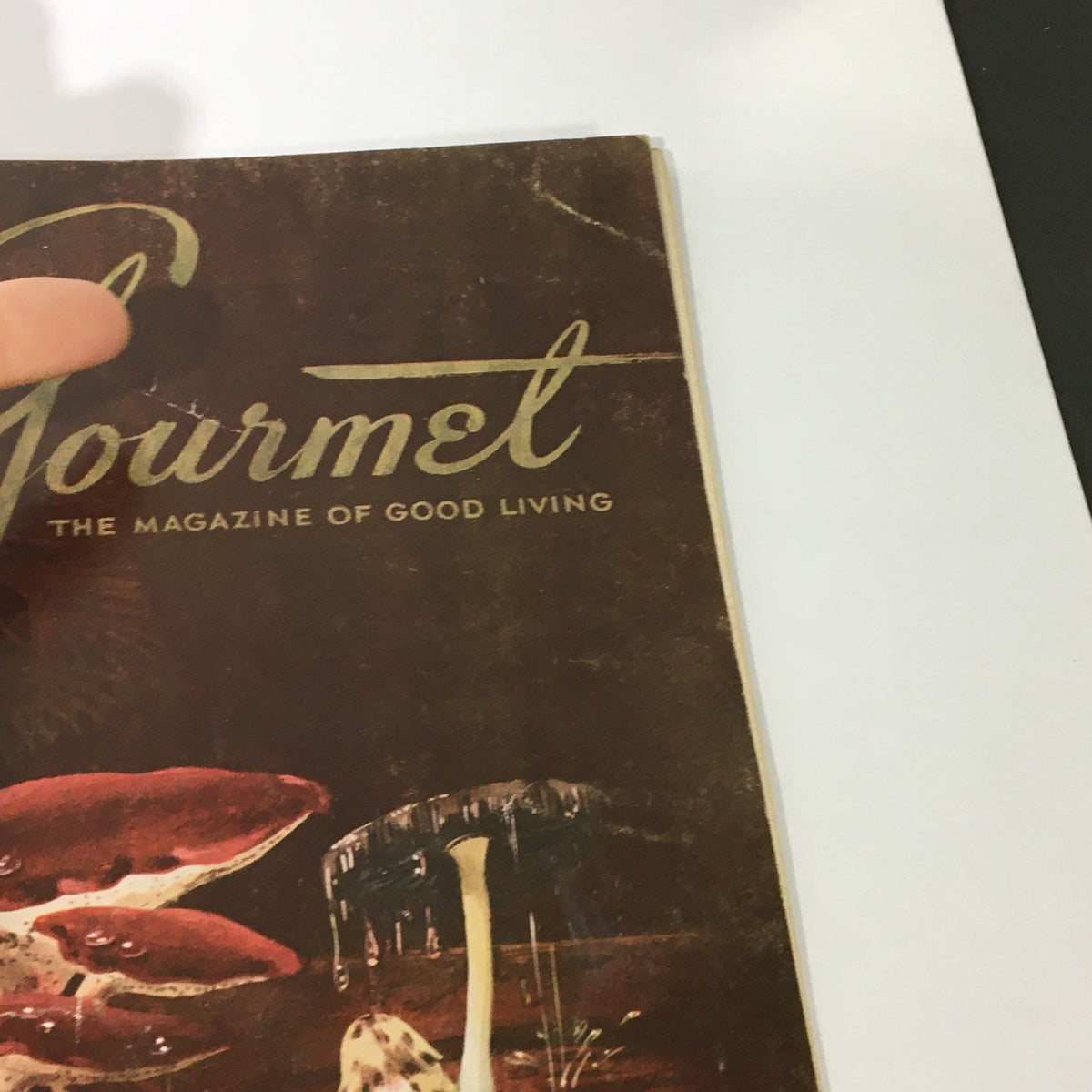Close-up of the cover of VTG Gourmet: The Magazine of Good Living - April 1958, highlighting the elegant title and artistic details.