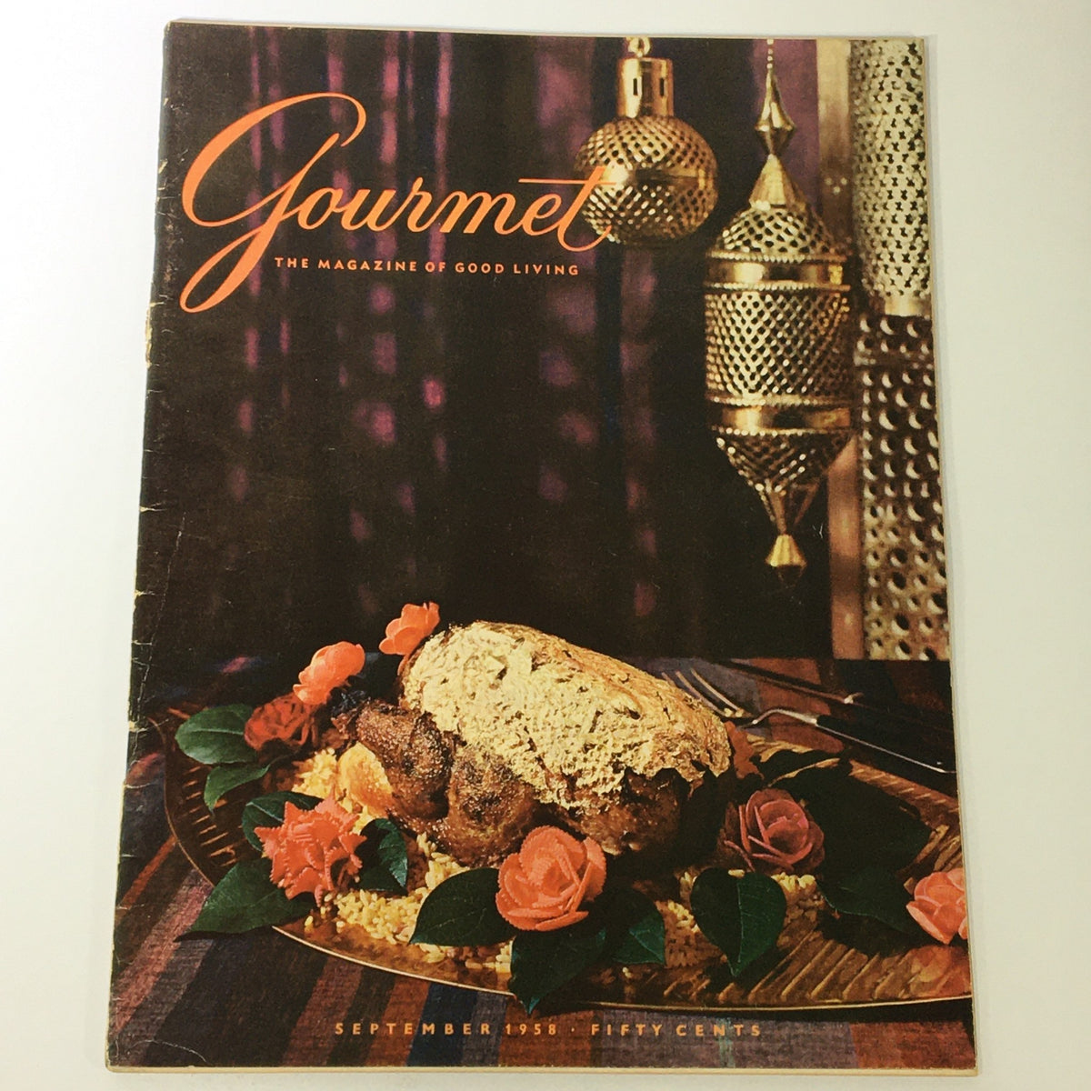 Gourmet Magazine September 1958 cover featuring a beautifully arranged dish with a loaf of bread, roses, and an elegant presentation.