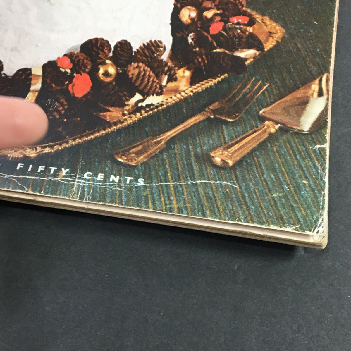Close-up of the VTG Gourmet The Magazine of Good Living December 1958 - Seasoned Greetings cover showing the cake and elegant serving utensils.
