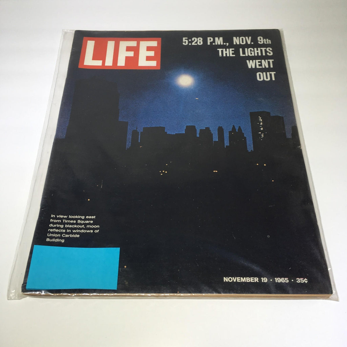 Vintage Life Magazine cover from November 19, 1965, featuring a view looking east from Times Square during a blackout with the moon reflecting in the windows of the Union Carbide Building.