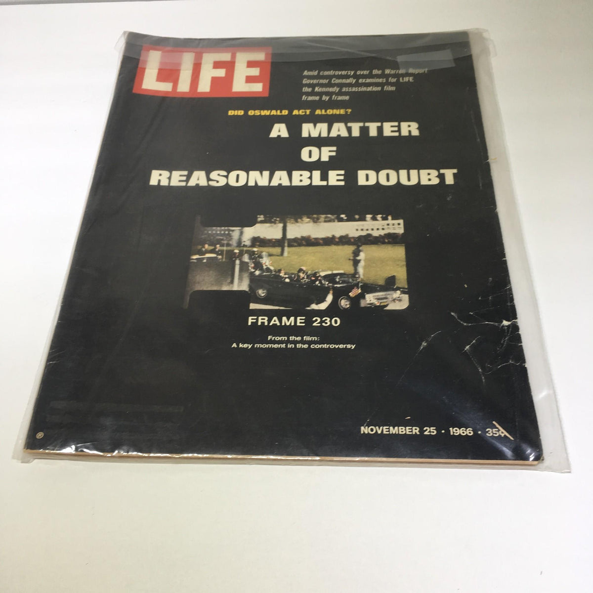 Vintage Life Magazine Cover featuring Lee Harvey Oswald and John F. Kennedy, dated November 25, 1966, showcasing an article titled 'A Matter of Reasonable Doubt' with a depiction of a key moment in the JFK assassination controversy.