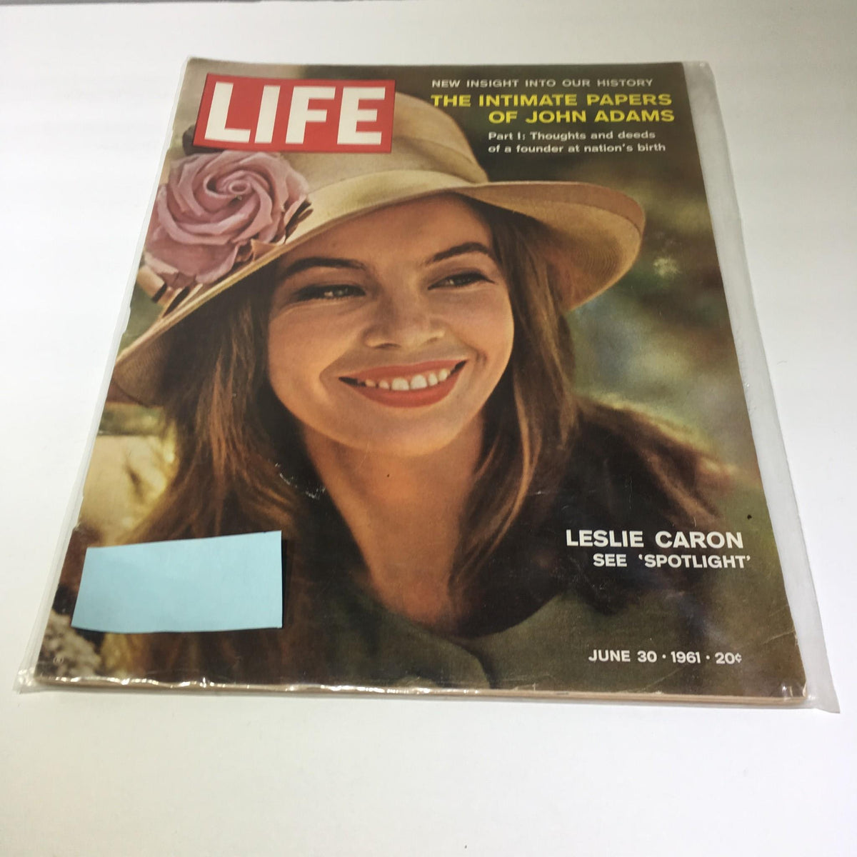 Vintage Life Magazine from August 30, 1961 featuring Leslie Caron on the cover, showcasing her charming smile and stylish hat, part of the J Adams spotlight series.