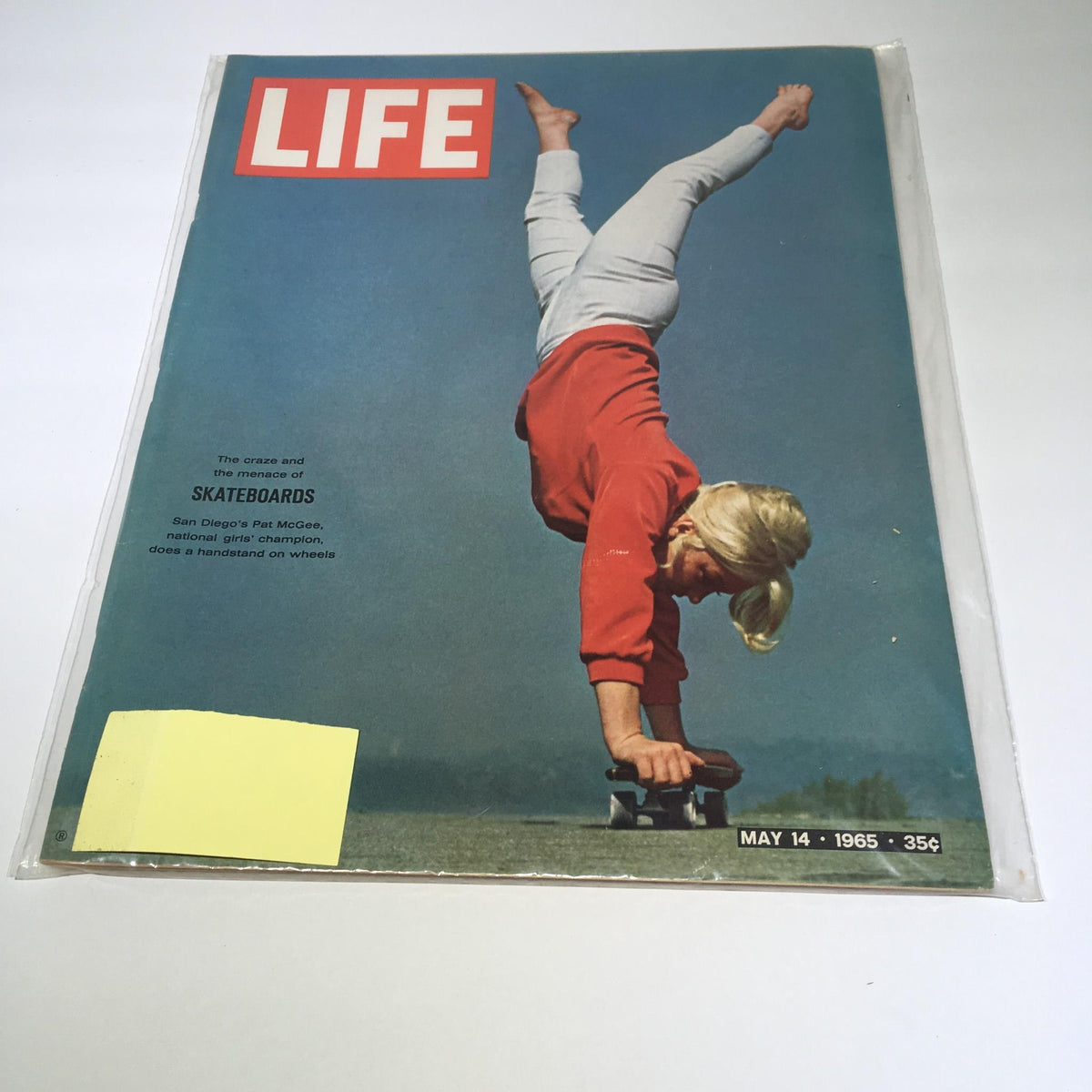 Cover of Life Magazine from May 14, 1965 titled 'The Craze & The Menace Of Skateboards' featuring a young girl performing a handstand on a skateboard, capturing the vibrant youth culture of the 1960s.