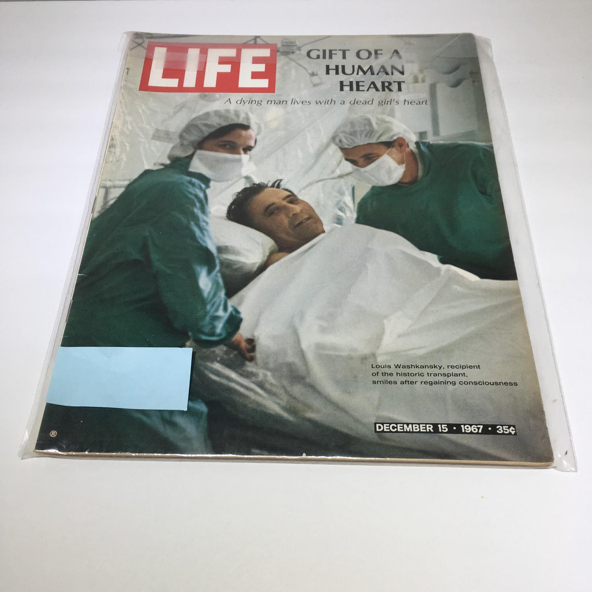 Cover of the December 15, 1967 Life Magazine featuring the title 'Gift of a Human Heart'. The image depicts Louis Washkansky, the first heart transplant recipient, surrounded by medical staff in operating room attire. This historic edition highlights medical advancements and the remarkable story of human resilience.