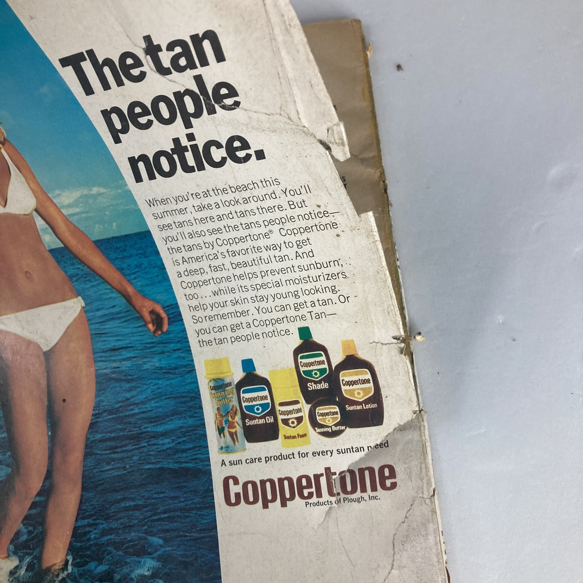 Ad for Coppertone sun care products from the 1974 issue of VTG Photoplay Magazine July 1974. The advertisement emphasizes summer tanning with various Coppertone products.
