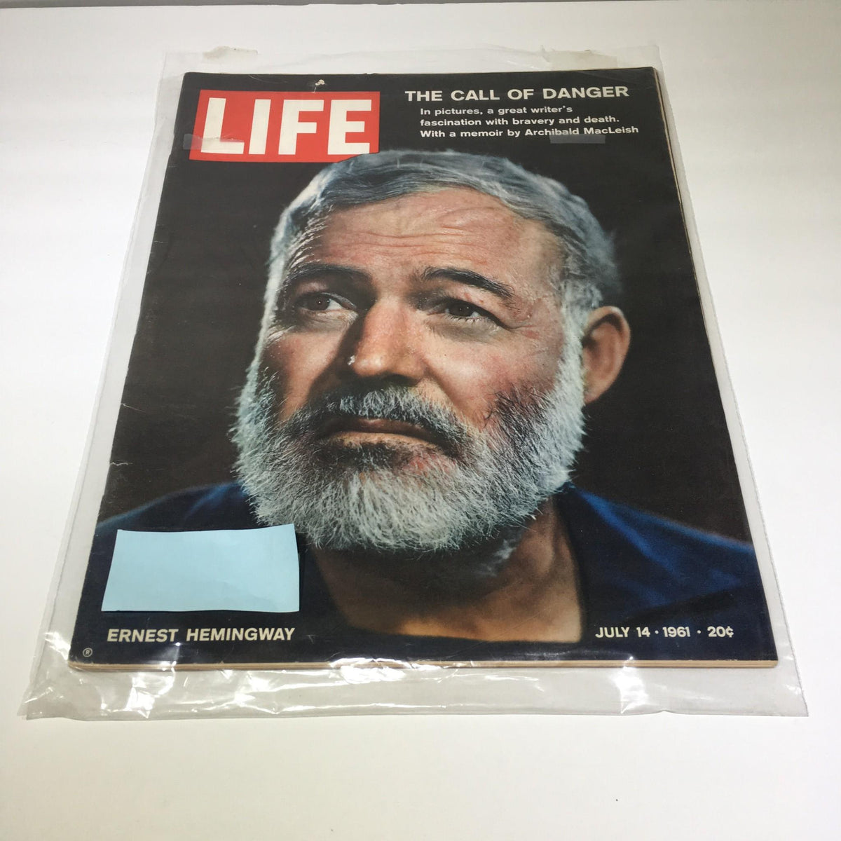 Cover of Life Magazine from July 14, 1961, featuring the title 'The Call Of Danger' with a portrait of Ernest Hemingway, highlighting his literary contributions and cultural significance.