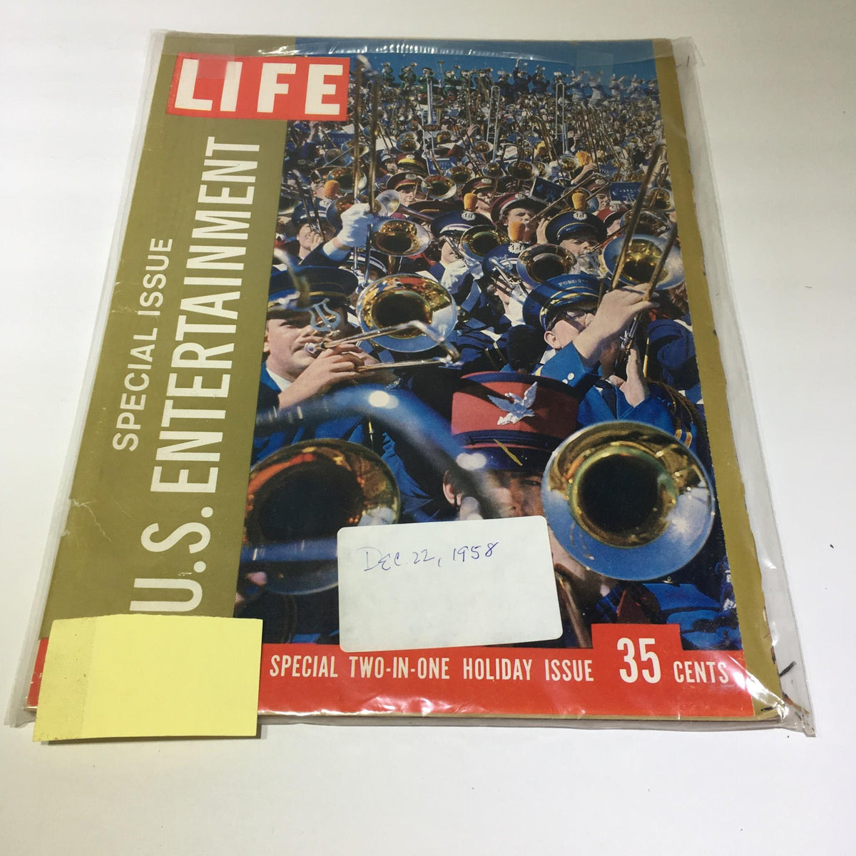 Cover of Life Magazine: Dec 22 1958 U.S Entertainment Special Double Issue featuring a vibrant illustration of a marching band with brass instruments, highlighted by the title 'LIFE' in bold red letters. This vintage magazine showcases iconic American pop culture from the late 1950s.