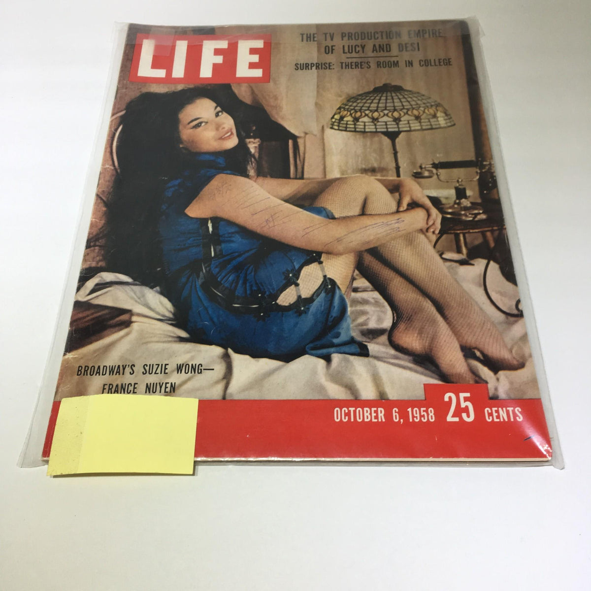 Cover of Vintage Life Magazine from October 6, 1958 featuring Broadway's Suzie Wong and France Nuyen, displaying a young woman in a blue dress, sitting in a stylish interior.