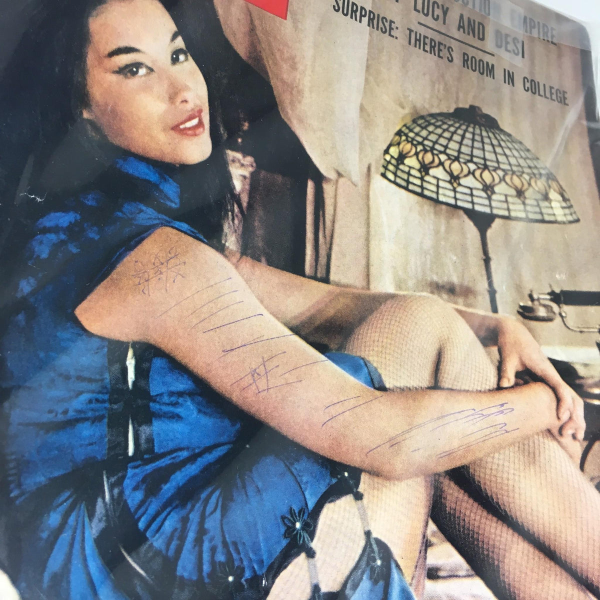 Detailed view of the cover of Vintage Life Magazine from October 6, 1958, showing Broadway's Suzie Wong, France Nuyen, with emphasis on the woman's expression and style.