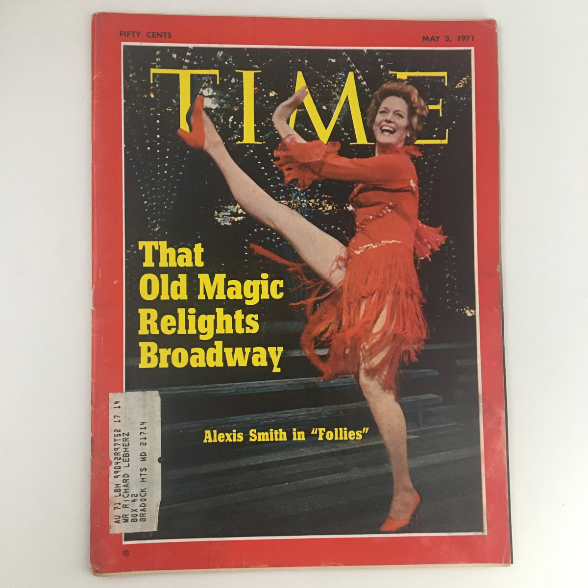 Cover of Time Magazine, May 3, 1971, Vol. 97 No. 18 featuring Alexis Smith in 'Follies', showcasing her energetic pose and vibrant red dress against a backdrop of Broadway lights, entitled 'That Old Magic Relights Broadway'.