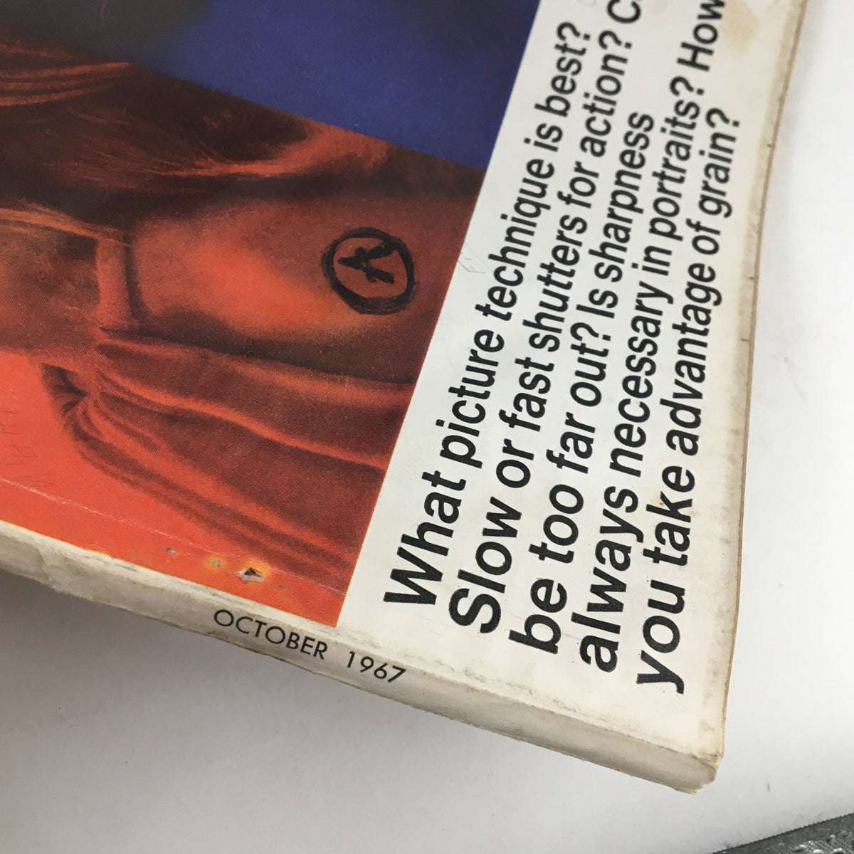 Close-up view of the cover of Modern Photography Magazine, October 1967, showcasing the title and text about photography techniques and vintage aesthetics.