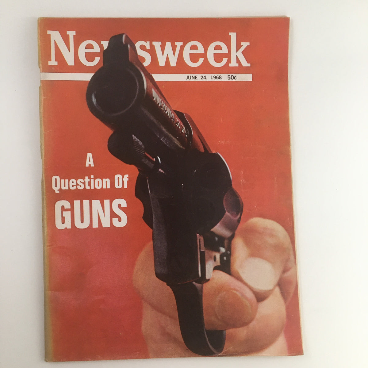 Cover of Newsweek Magazine June 24, 1968 featuring the striking title 'A Question About The Guns' with an image of a hand holding a revolver against a bold red background.