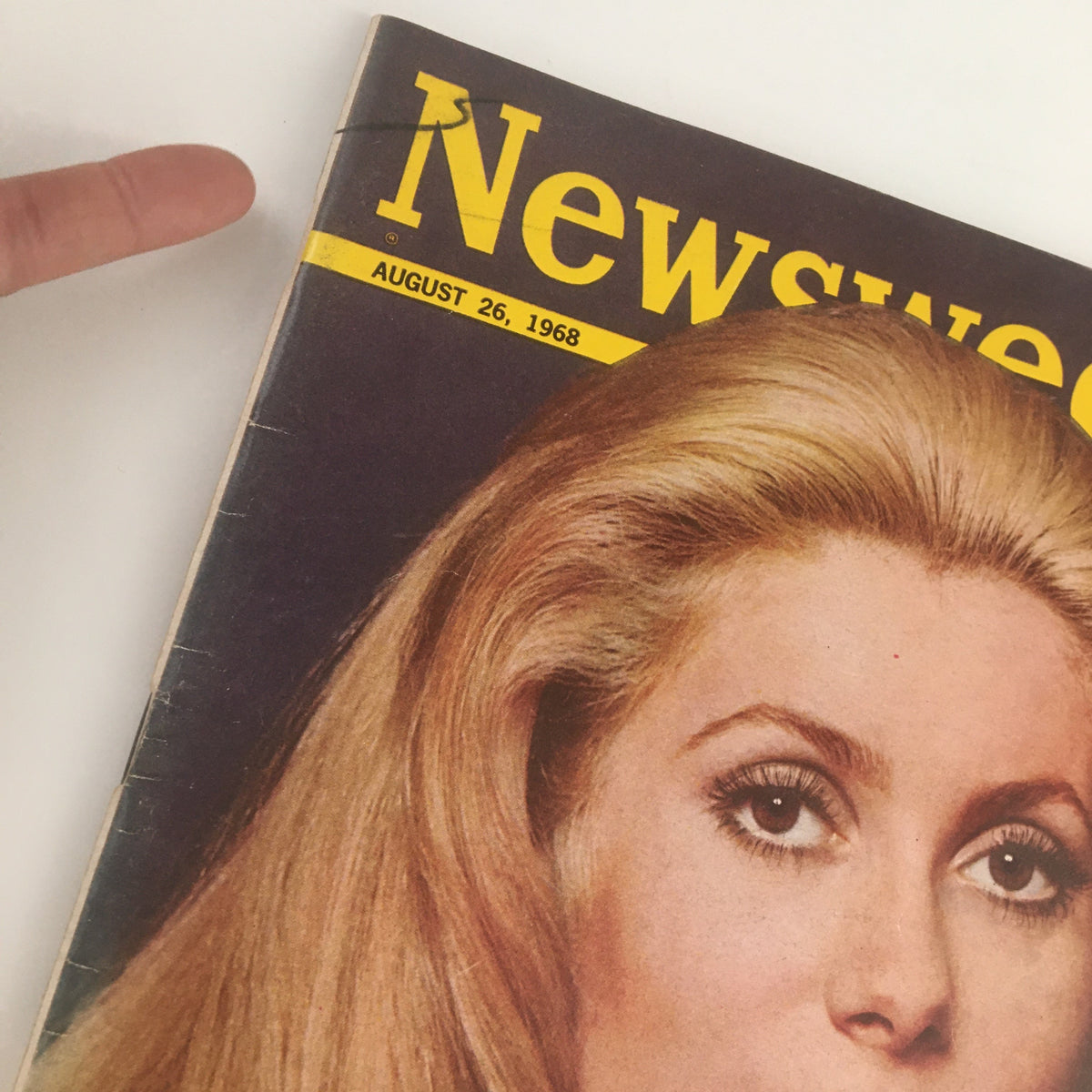 Close-up of the August 26, 1968 issue of Newsweek Magazine featuring French Actress Catherine Deneuve on the cover, showcasing the magazine's title and date prominently.
