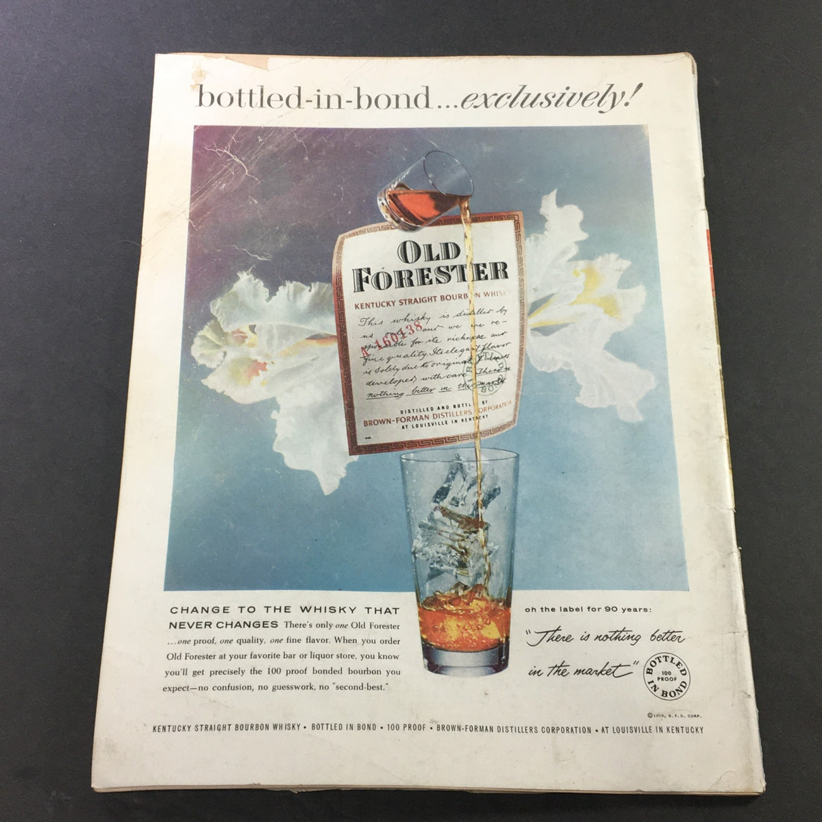 Back cover of VTG Gourmet The Magazine of Good Living March 1959 featuring an advertisement for Old Forester Bourbon, displaying attractive vintage graphics.