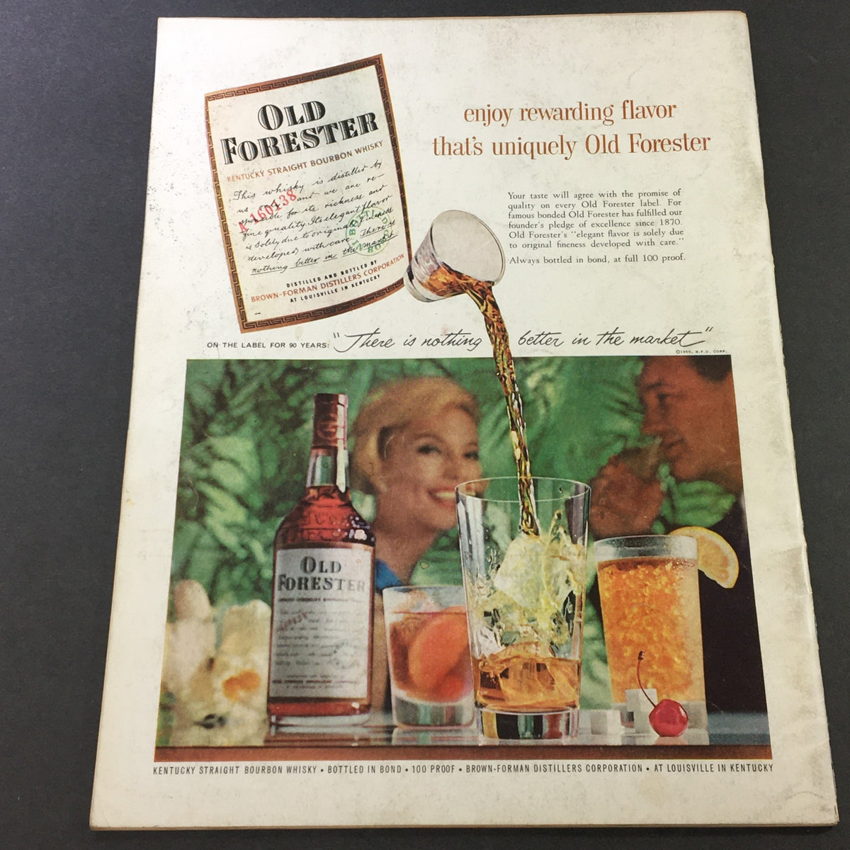 Back cover of VTG Gourmet: The Magazine of Good Living, July 1959, showcasing an advertisement for Old Forester bourbon with a woman enjoying a drink in a vibrant setting.