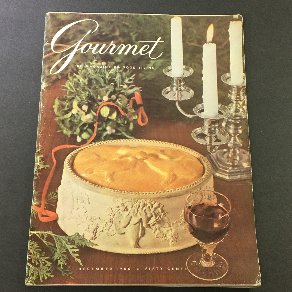 Cover of VTG Gourmet The Magazine of Good Living, December 1960, featuring a festive holiday scene with a decorative cake, candles, and elegant table setting.
