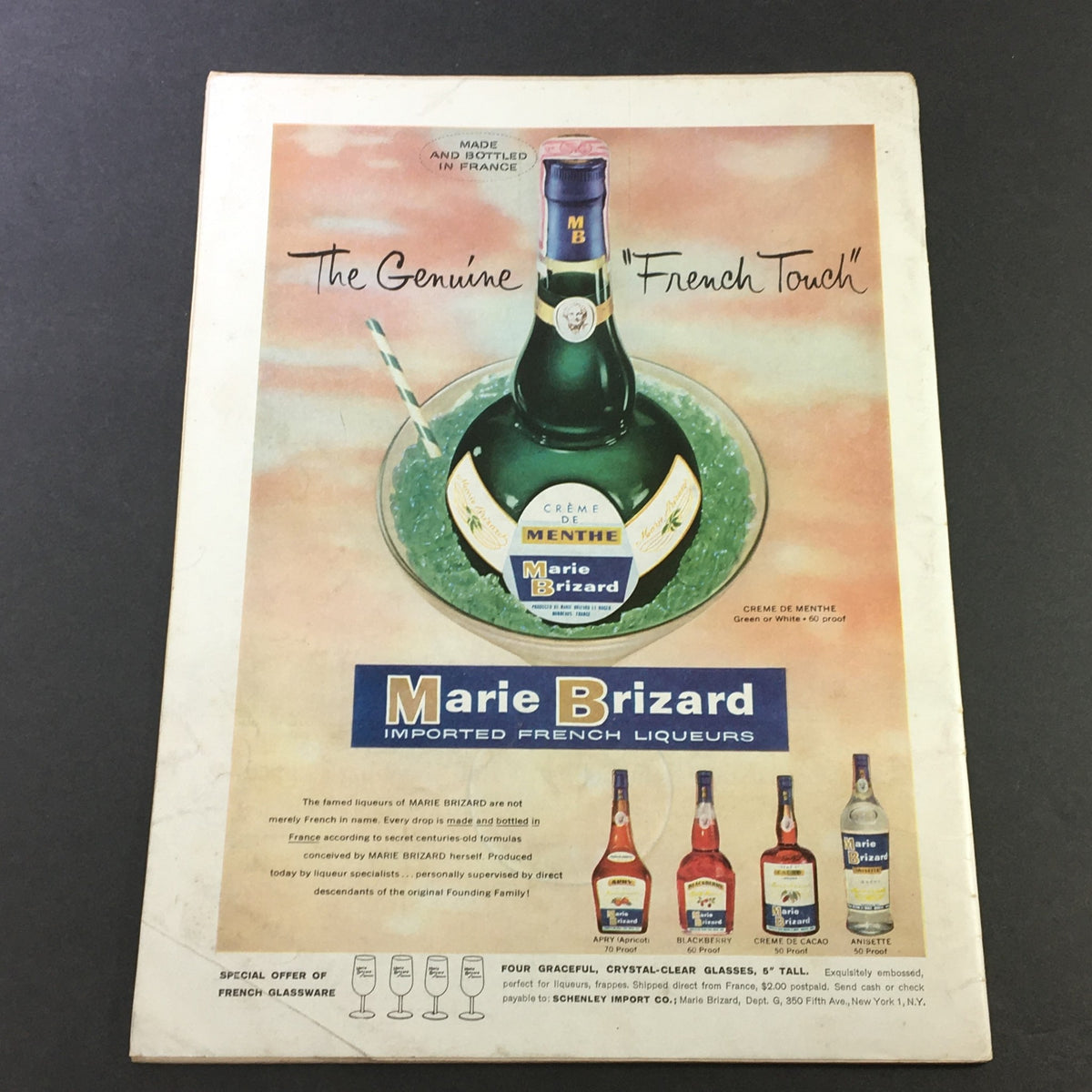 Back cover of VTG Gourmet: The Magazine of Good Living, August 1960, featuring an advertisement for Marie Brizard imported French liqueurs, demonstrating vintage marketing design.