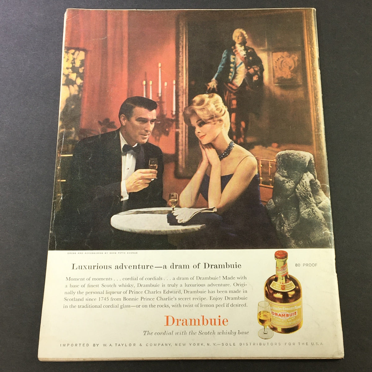 Vintage advertisement from VTG Gourmet: The Magazine of Good Living September 1961 - Guests of the Grandee showcasing a couple enjoying drinks by candlelight with a painting in the background.