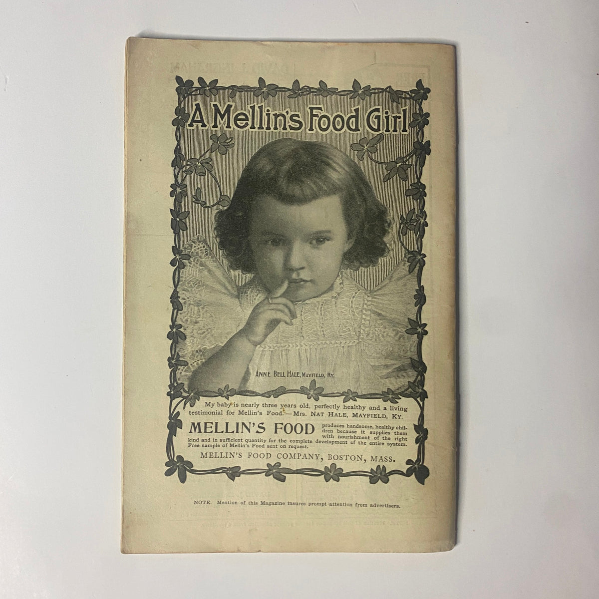 Ad page in The New England Home Magazine, August 20, 1899, featuring a vintage advertisement for Mellin's Food with an image of a young girl. This issue highlights aspects of early American culture and advertising.