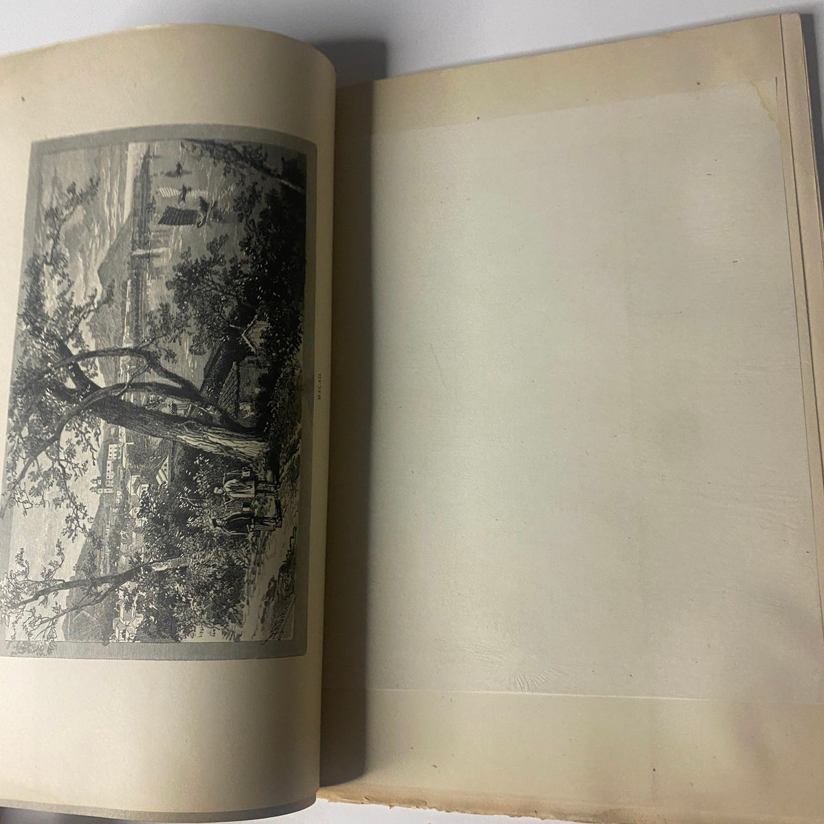 Interior page of "Around the World with General Grant - Book by John Russell Young, Part Sixteen" showcasing a blank page opposite an illustration.