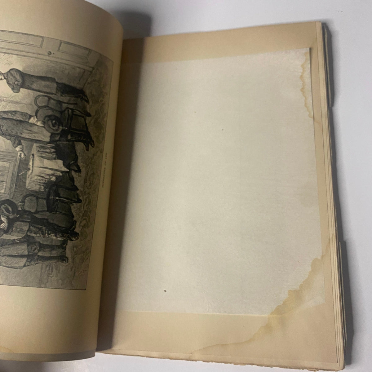 Interior page of 'Around the World with General Grant' by John Russell Young, Part Thirteen, featuring a blank page with visible water damage at the edges.