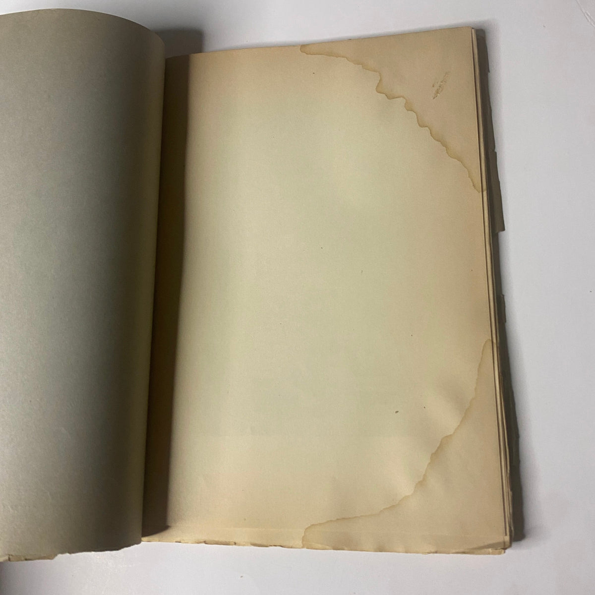 Interior page of 'Around the World with General Grant' Book by John Russell Young, Part Fourteen, showing water-damaged edge and yellowed paper.