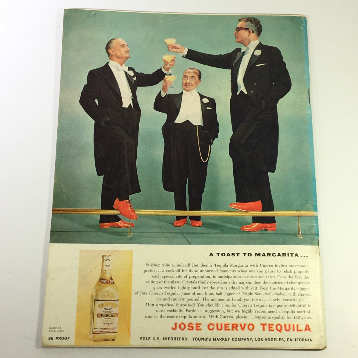 Vintage advertisement for Jose Cuervo Tequila featuring elegantly dressed men toasting with margarita glasses. Part of the VTG Gourmet The Magazine of Good Living June 1959 - The Ticklish Trout edition, this illustration highlights the sophisticated dining culture of the era.