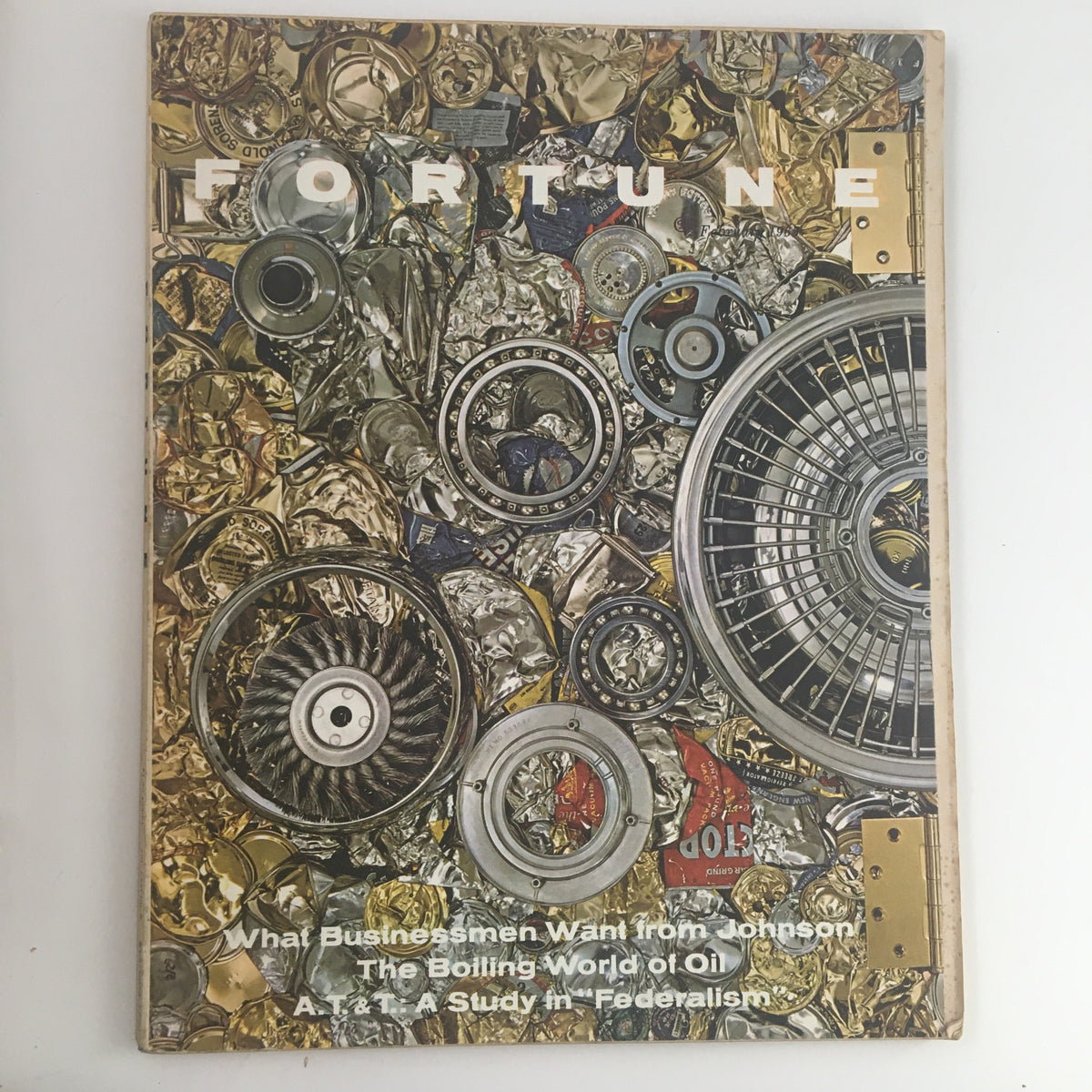 Cover of Fortune Magazine, February 1965, featuring an artistic layout of metallic components, reflecting the theme 'The Boiling World of Oil & Federalism', with headlines on business and energy policies.