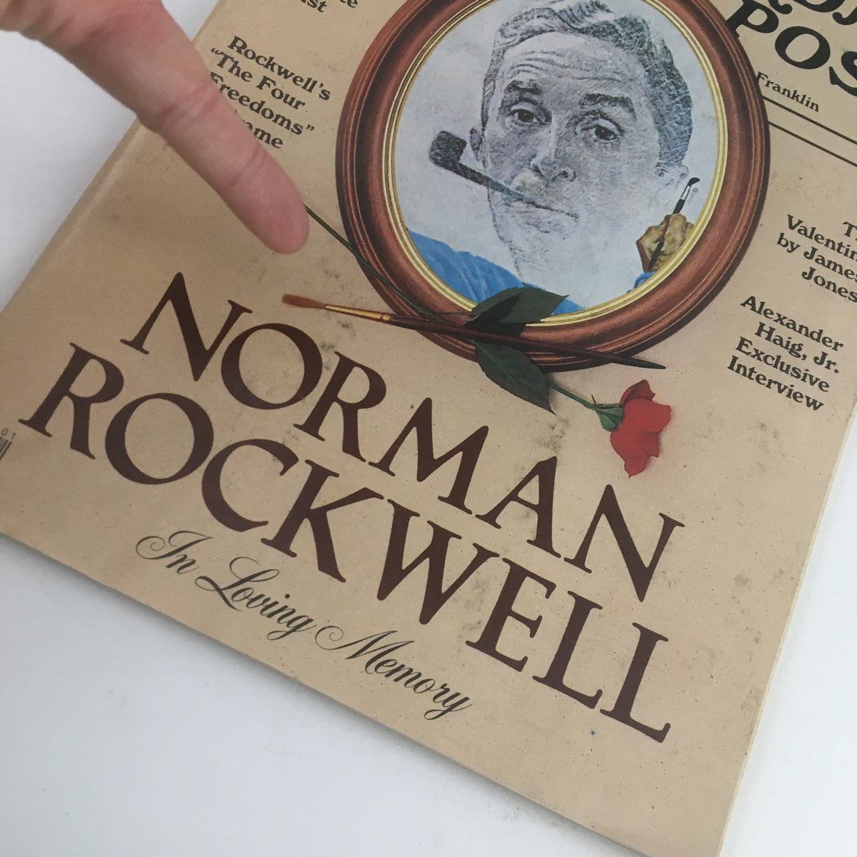 Detailed view of The Saturday Evening Post February 1979 cover showcasing Norman Rockwell's Loving Memory, featuring a framed portrait of a man with a rose.
