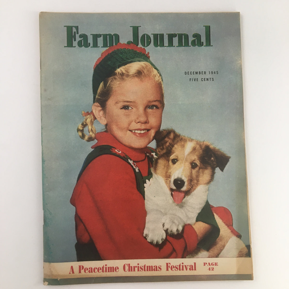 Cover of Farm Journal Magazine December 1945 featuring a young girl with blonde pigtails holding a collie puppy, titled 'A Peacetime Christmas Festival'.