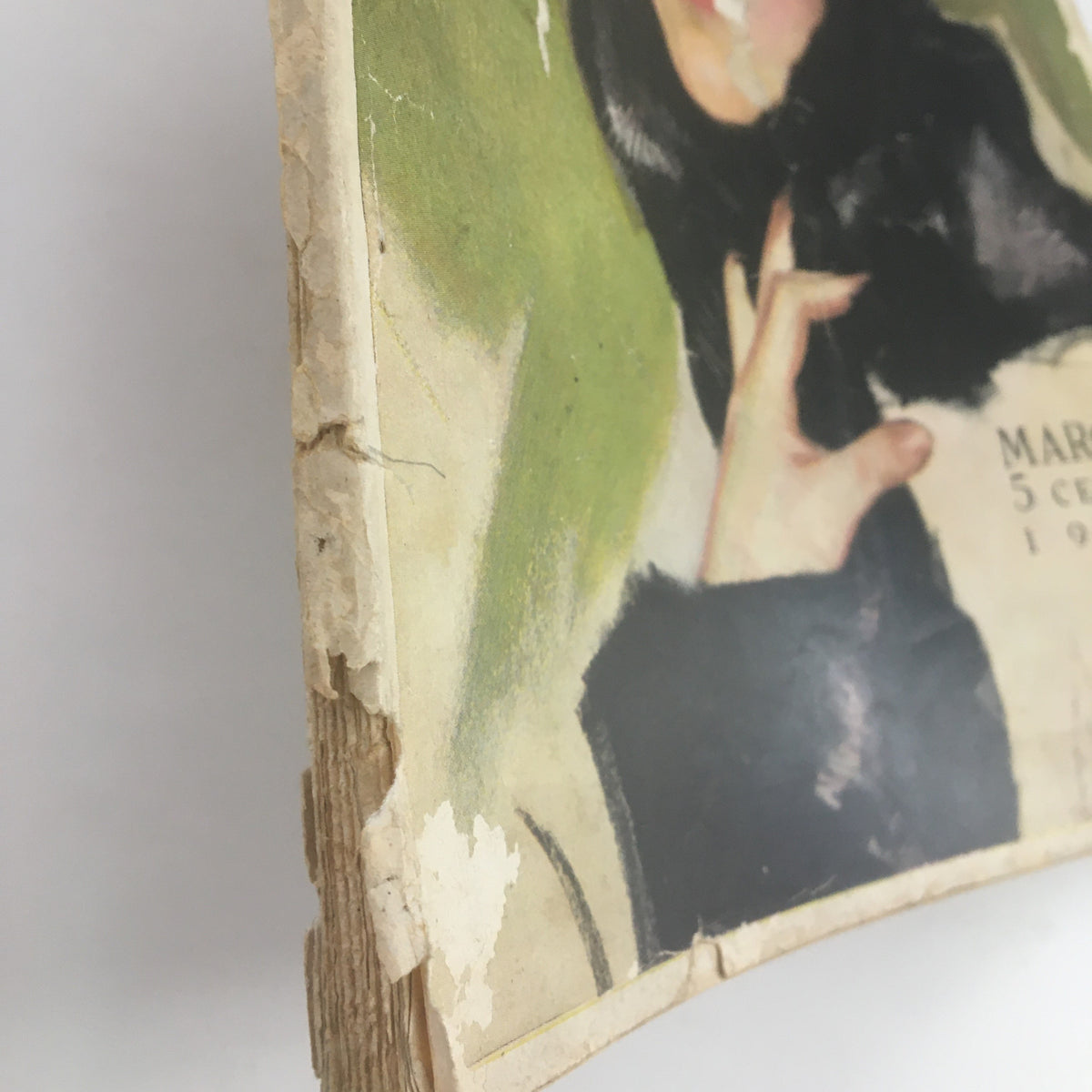 Side view of the worn edge of VTG McCall's Magazine March 1916, highlighting its vintage condition and authenticity.