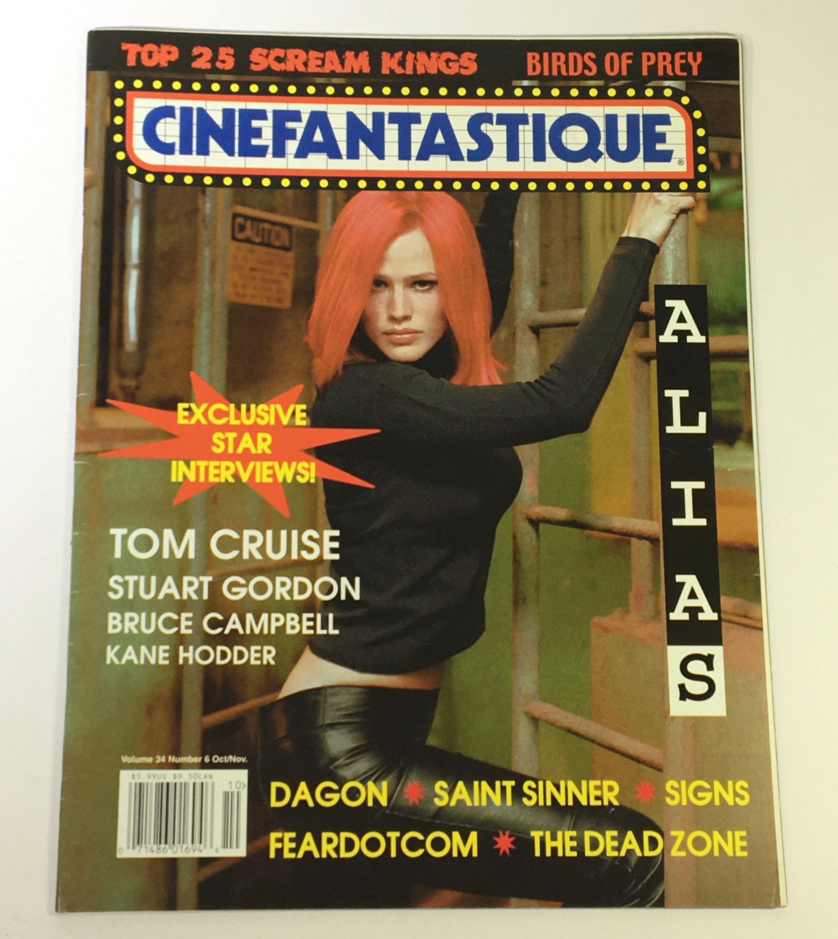 Cinefantastique October November 2002 Vol 34 #6 featuring Jennifer Garner and Tom Cruise on the cover, showcasing a striking image of a woman with red hair in a black outfit, along with listings of exclusive star interviews and films such as Dagon and The Dead Zone.