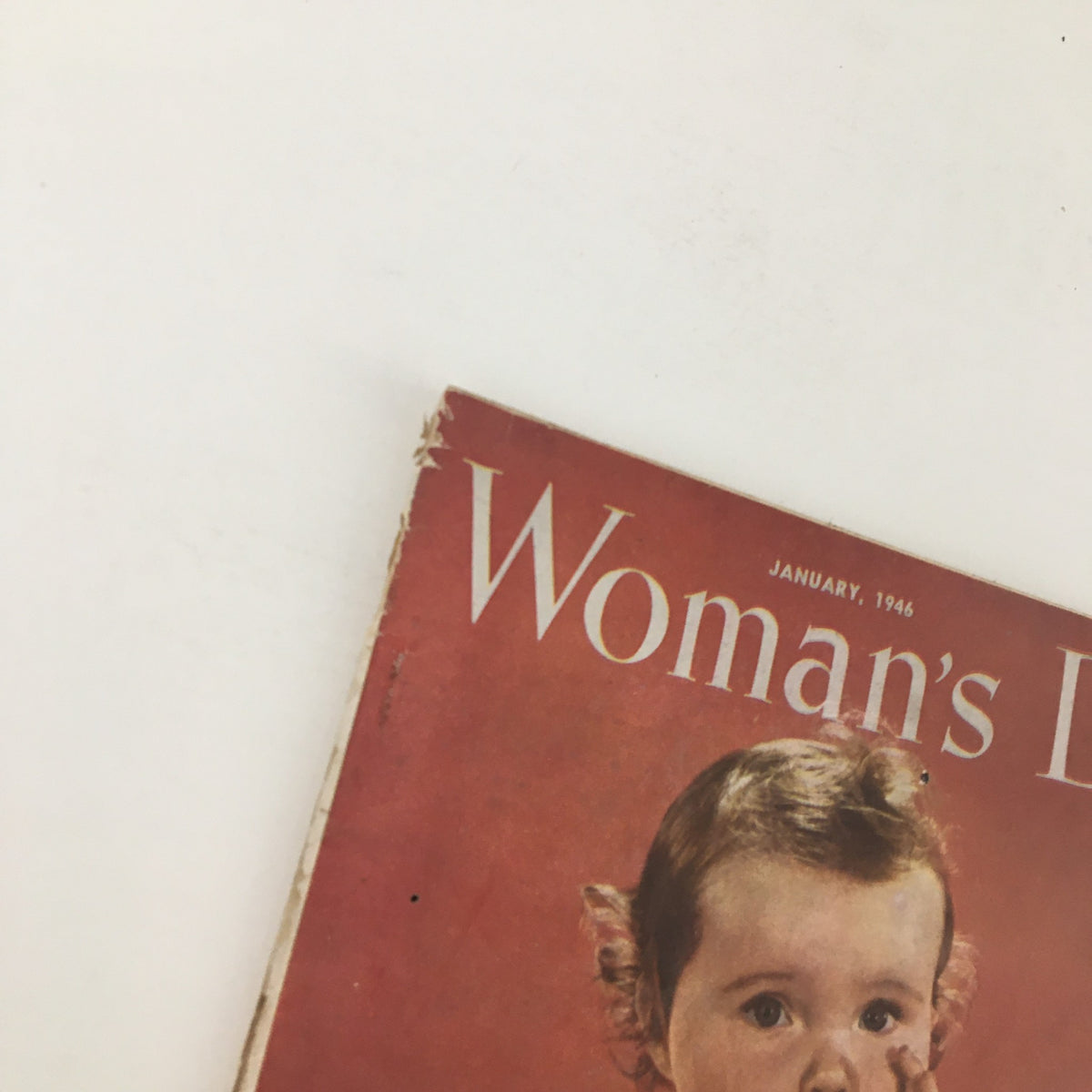 Cover of Woman's Day Magazine January 1946 featuring a vintage design and a baby portrait.