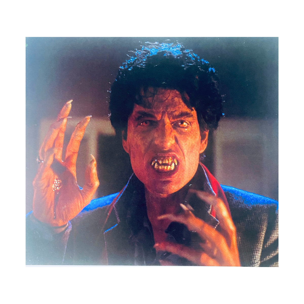 A scene from 'Fright Night' depicting a vampire character with dramatic makeup and fangs, highlighted in Cinefex Magazine February 1986 No. 25.