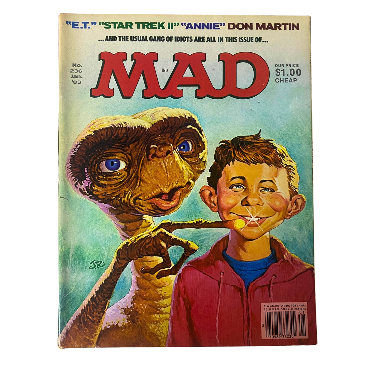 Mad Magazine January 1983 Issue No. 236 featuring parodies of E.T., Star Trek II, and Annie on the cover, showcasing a character resembling E.T. alongside a boy, indicative of the magazine's satirical humor.